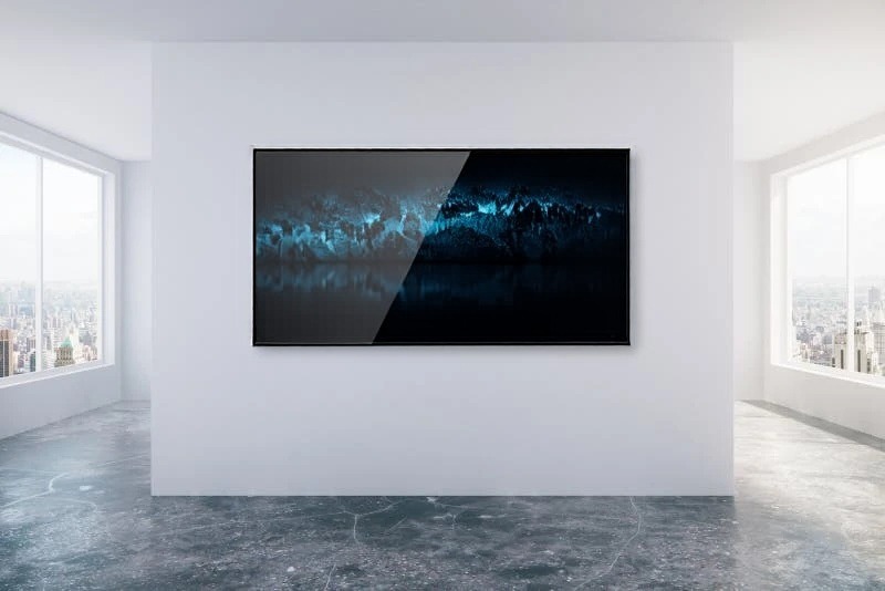 An 85-inch TV flush-mounted on the wall of an open-plan loft with city windows, placed by AI